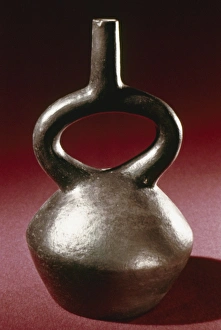 PERU: CHIMU JAR. Polished blackware stirrup jar, made by the Chimu culture of ancient Peru PERU: CHIMU JAR. Polished blackware stirrup jar, made by the Chimu culture of ancient Peru