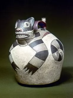 PERU: NAZCA WHISTLING JAR. Ceramic whistling water jar with a sculpted cat on the top