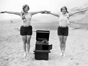 PHONOGRAPH, c1929. Joan Crawford and Dorothy Sebastian photographed c1929 with a portable phonograph in Santa Monica