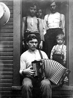 PITTSBURGH STEEL WORKER relaxing at home; photographed in 1908 by Lewis Hine PITTSBURGH STEEL WORKER relaxing at home; photographed in 1908 by Lewis Hine