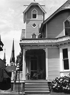 FRONT PORCH, 1938. Woman sitting on the front porch of a home on 4 July 1938, at Dover FRONT PORCH, 1938. Woman sitting on the front porch of a home on 4 July 1938, at Dover