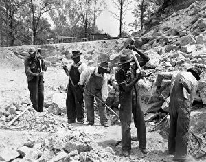Denim Gallery: PRISONERS. Five African American convicts breaking up rocks for road construction