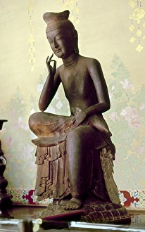 Red pine wood statue of Buddha of the Future, called Miroku Bosatsu or Maitreya Red pine wood statue of Buddha of the Future, called Miroku Bosatsu or Maitreya