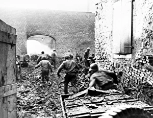 After a round of bombardment by artillery shells, members of the 87th Mortar Division, U After a round of bombardment by artillery shells, members of the 87th Mortar Division, U