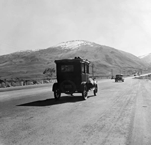 RURAL HIGHWAY, 1939. Migrant workers traveling on U.S. Highway 99 between Imperial RURAL HIGHWAY, 1939. Migrant workers traveling on U.S. Highway 99 between Imperial