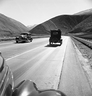 RURAL HIGHWAY, 1939. Migrant workers traveling on U.S. Highway 99 between Imperial RURAL HIGHWAY, 1939. Migrant workers traveling on U.S. Highway 99 between Imperial