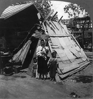SICILY: REFUGEE FAMILY. A family in a makeshift shelter SICILY: REFUGEE FAMILY. A family in a makeshift shelter