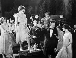 <b class=qtipBold><figcaption>Silent Film Still: Drinking</figcaption></b><br>Silent Film Still: Drinking.<br><em>© none</em> Silent Film Still: Drinking