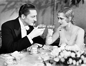 <b class=qtipBold><figcaption>Silent Film Still: Drinking</figcaption></b><br>Silent Film Still: Drinking.<br><em>© none</em> Silent Film Still: Drinking