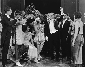 <b class=qtipBold><figcaption>Silent Film Still: Drinking</figcaption></b><br>Silent Film Still: Drinking.<br><em>© none</em> Silent Film Still: Drinking