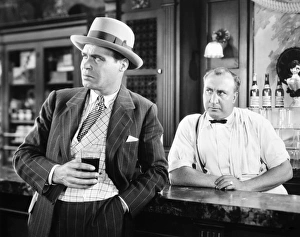 <b class=qtipBold><figcaption>Silent Film Still: Drinking</figcaption></b><br>Silent Film Still: Drinking.<br><em>© none</em> Silent Film Still: Drinking