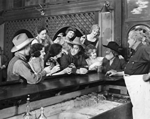 <b class=qtipBold><figcaption>Silent Film Still: Drinking</figcaption></b><br>Silent Film Still: Drinking.<br><em>© none</em> Silent Film Still: Drinking