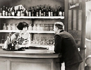 <b class=qtipBold><figcaption>Silent Film Still: Drinking</figcaption></b><br>Silent Film Still: Drinking.<br><em>© none</em> Silent Film Still: Drinking