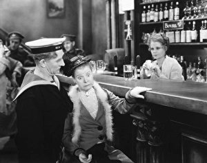 <b class=qtipBold><figcaption>Silent Film Still: Drinking</figcaption></b><br>Silent Film Still: Drinking.<br><em>© none</em> Silent Film Still: Drinking