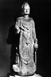 Standing stone figure of a bodhisattva, with traces of polychrome. Height: 47 in Standing stone figure of a bodhisattva, with traces of polychrome. Height: 47 in