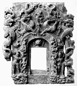 Stone relief work from the front of a Buddhist shrine, depicting dragons, lions Stone relief work from the front of a Buddhist shrine, depicting dragons, lions