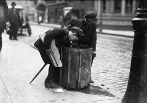 STREET BOYS, 1916. Three boys looking through a garbage can, Fall River, Massachusetts STREET BOYS, 1916. Three boys looking through a garbage can, Fall River, Massachusetts