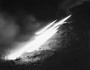 T-66 multiple rocket launchers, of the 40th U.S. Infantry Division, fire salves of rockets at North Korean positions