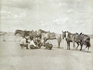 TEXAS: COWBOYS, c1907. Five cowboys gathered together as one of them draws a map TEXAS: COWBOYS, c1907. Five cowboys gathered together as one of them draws a map