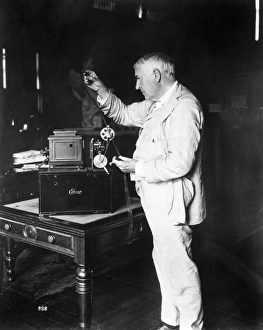 THOMAS EDISON (1847-1931). American inventor. With a Home Projecting Kinetoscope THOMAS EDISON (1847-1931). American inventor. With a Home Projecting Kinetoscope