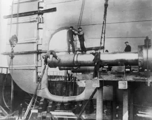 Prints of TITANIC: CONSTRUCTION, 1912. Workers assembling the propeller shafts of the RMS Titanic at Harland and Wolff shipyard in Belfast, Ireland. Photograph, c1912 Belfast Prints: Print of workers assembling propeller shafts at Harland & Wolff shipyard