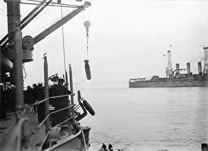 TORPEDO, 1913. Sailors hauling torpedoes on board an American warship. Photograph, 1913 TORPEDO, 1913. Sailors hauling torpedoes on board an American warship. Photograph, 1913