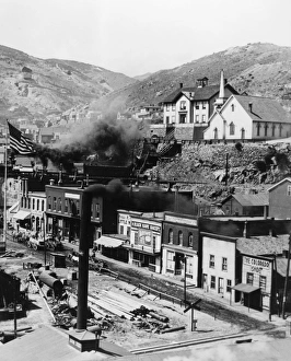 A view of Gregory Street in Black Hawk, Colorado. A Presbyterian church, next to a schoolhouse, is visible on the hillside in the foreground. Photographed by Harry H. Lake, c1899 A view of Gregory Street in Black Hawk, Colorado. A Presbyterian church, next to a schoolhouse, is visible on the hillside in the foreground. Photographed by Harry H. Lake, c1899