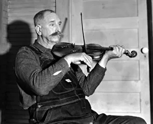 Denim Gallery: VIRGINIA: FIDDLER, 1934. Davy Crockett Ward, a fiddler with the Bog Trotters Band