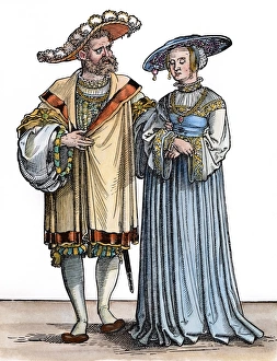 WEALTHY COUPLE, c1531. A wealthy couple going to a dance WEALTHY COUPLE, c1531. A wealthy couple going to a dance