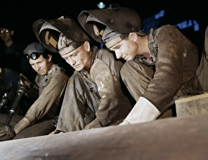 WELDERS, 1942. Employees of the Combustion Engineering Company making boilers for WELDERS, 1942. Employees of the Combustion Engineering Company making boilers for