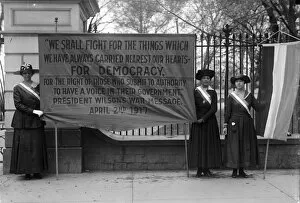 Protester Gallery: WHITE HOUSE: SUFFRAGETTES. Women suffragettes holding a banner addressing President Woodrow Wilson