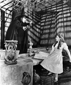 WIZARD OF OZ, 1939. Margaret Hamilton as the Wicked Witch of the West and Judy Garland as Dorothy
