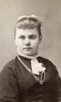 WOMAN, c1880. Portrait of a young woman. Carte de visite from a photography studio in WOMAN, c1880. Portrait of a young woman. Carte de visite from a photography studio in