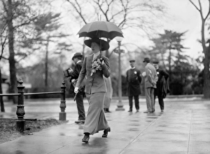 WOMAN, c1913. A woman carrying an umbrella, possibly in Washington, D.C. Photograph WOMAN, c1913. A woman carrying an umbrella, possibly in Washington, D.C. Photograph