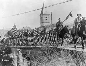 WORLD WAR I: AMERICAN TROOPS, c1917. American soldiers cross a bridge in Europe WORLD WAR I: AMERICAN TROOPS, c1917. American soldiers cross a bridge in Europe