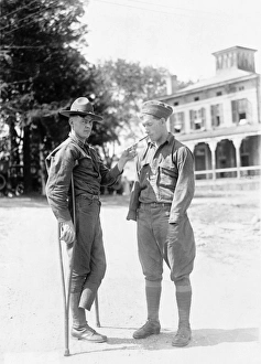 WWI: VETERANS, c1918. A soldier, missing a foot, lights a cigarette for another WWI: VETERANS, c1918. A soldier, missing a foot, lights a cigarette for another