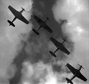 Images Dated 16th November 2011: WWII: P-51 MUSTANGS, 1945. Four P-51 Mustang fighter planes flying in formation over Ramitelli