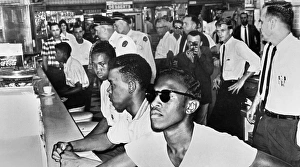 Four young black men sitting in at a segregated lunch counter at a drug store in Jackson Four young black men sitting in at a segregated lunch counter at a drug store in Jackson