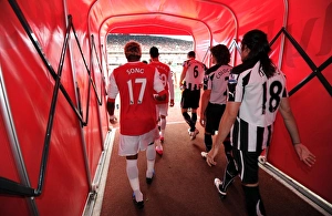 Alex Song (Arsenal) and Fabricio Coloccini (Newcastle) walk out of the players tunnel Alex Song (Arsenal) and Fabricio Coloccini (Newcastle) walk out of the players tunnel