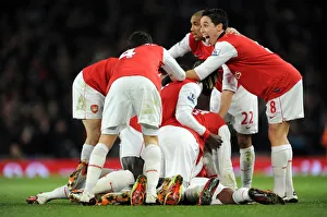 Alex Song celebrates scoring Arsenal's 1st goal with his team mates including Samir Alex Song celebrates scoring Arsenal's 1st goal with his team mates including Samir