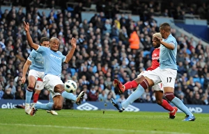 Alex Song shoots past Man City goalkeeper Joe Hart to score the 2nd Arsenal goal Alex Song shoots past Man City goalkeeper Joe Hart to score the 2nd Arsenal goal