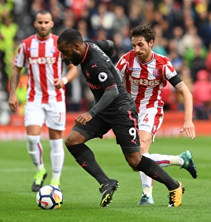 Alexandre Lacazette (Arsenal) Joe Allen (Stoke). Stoke City 1:0 Arsenal. Premier League Alexandre Lacazette (Arsenal) Joe Allen (Stoke). Stoke City 1:0 Arsenal. Premier League