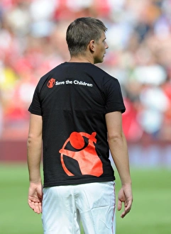 Andrey Arshavin (Arsenal) in a Save the Children t shirt. Arsenal 1:1 New York Red Bulls Andrey Arshavin (Arsenal) in a Save the Children t shirt. Arsenal 1:1 New York Red Bulls