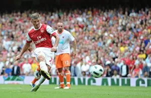 Images Dated 21st August 2010: Andrey Arshavin shoots past Blackpool goalkeeper Matthew Gilks from the penalty spot to score