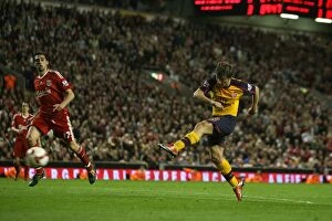 Images Dated 21st April 2009: Andrey Arshavin shoots past Liverpool goalkeeper Pepe