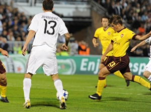 Andrey Arshavin shoots past Vladimir Stojkovic to score the 1st Arsenal goal Andrey Arshavin shoots past Vladimir Stojkovic to score the 1st Arsenal goal