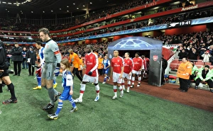 Arsenal captain Manuel Almunia followed by Bacary Sagna Arsenal captain Manuel Almunia followed by Bacary Sagna