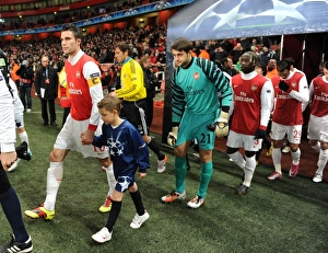 Arsenal captain Robin van Persie leads out the team. Arsenal 3:1 Partizan Belgrade Arsenal captain Robin van Persie leads out the team. Arsenal 3:1 Partizan Belgrade