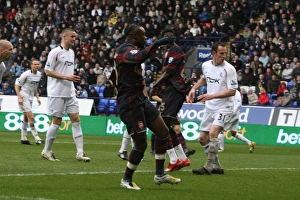 Arsenal captain William Gallas shoots past Bolton goalkeeper Ali Al Hasbi to score the Arsenal captain William Gallas shoots past Bolton goalkeeper Ali Al Hasbi to score the