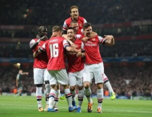Images Dated 1st October 2013: Arsenal Celebrate as Ozil Scores First Goal vs Napoli in 2013-14 Champions League